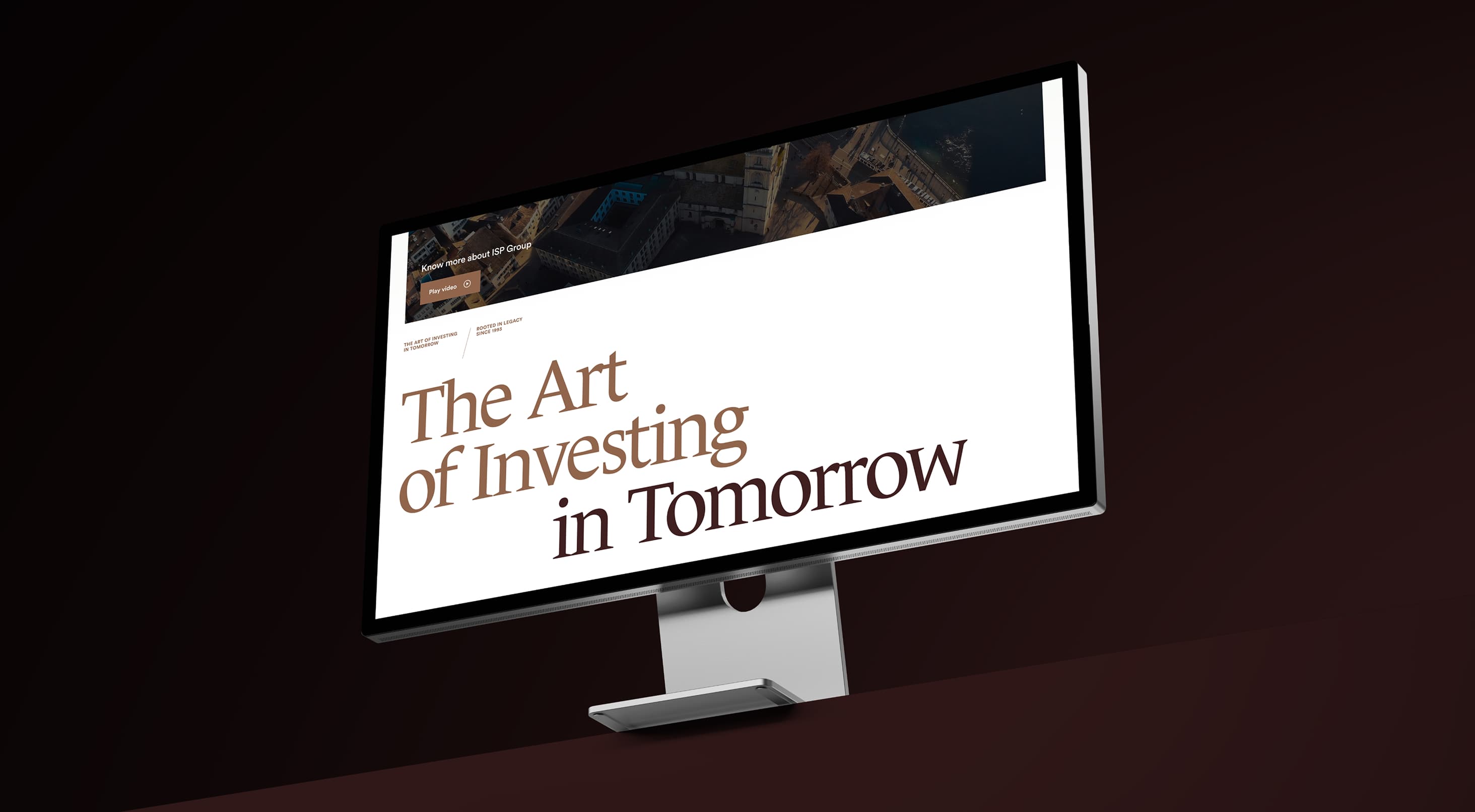 Desktop monitor showing the ISP Group website headline "The Art of Investing in Tomorrow"