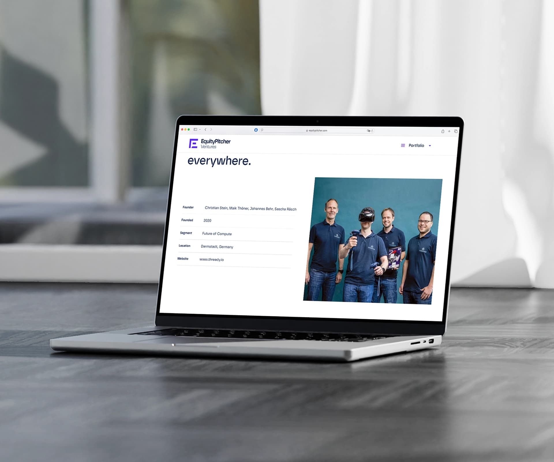 The EquityPitcher website on a laptop, showing a team photo
