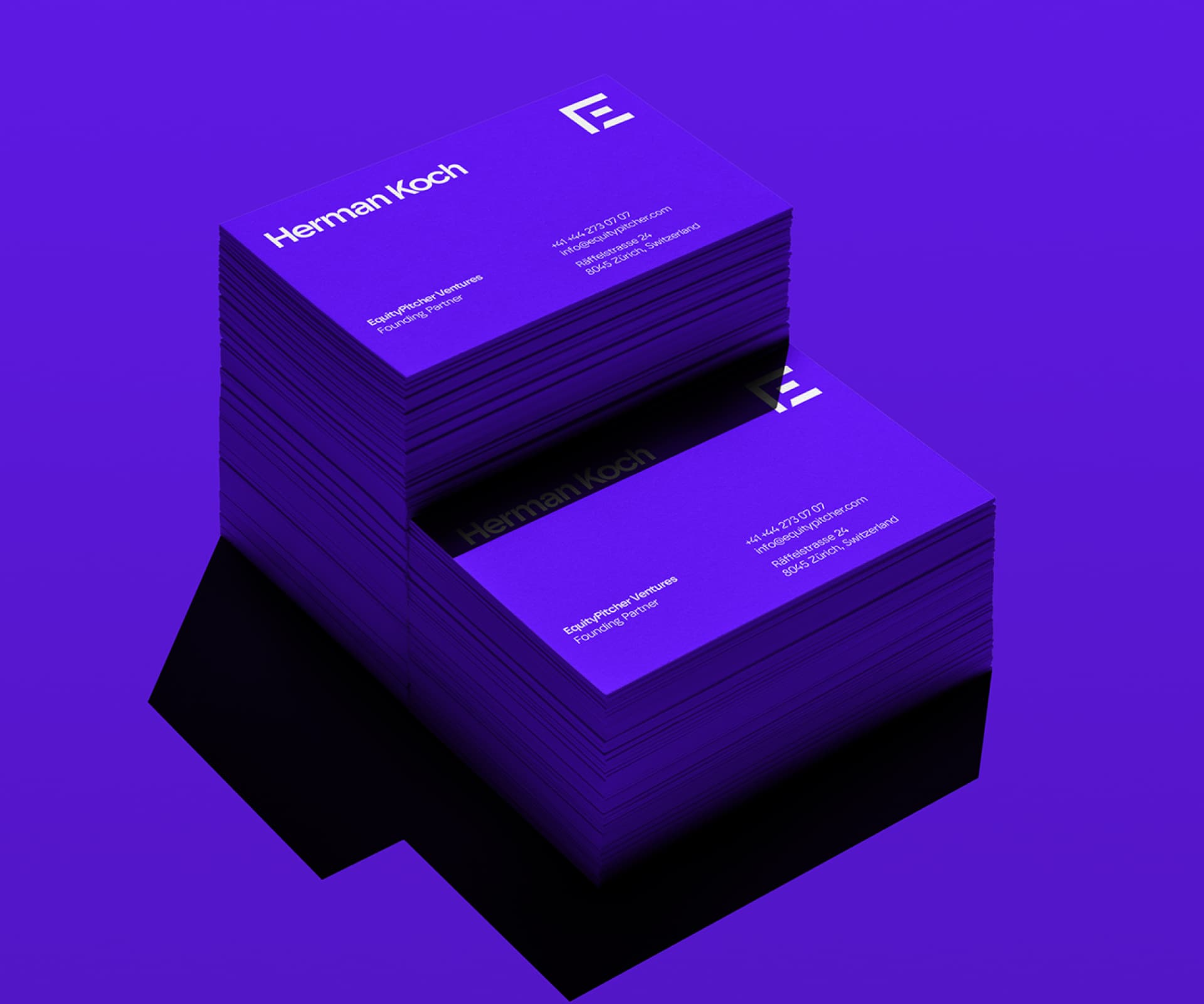 Two stacks of purple EquityPitcher business cards