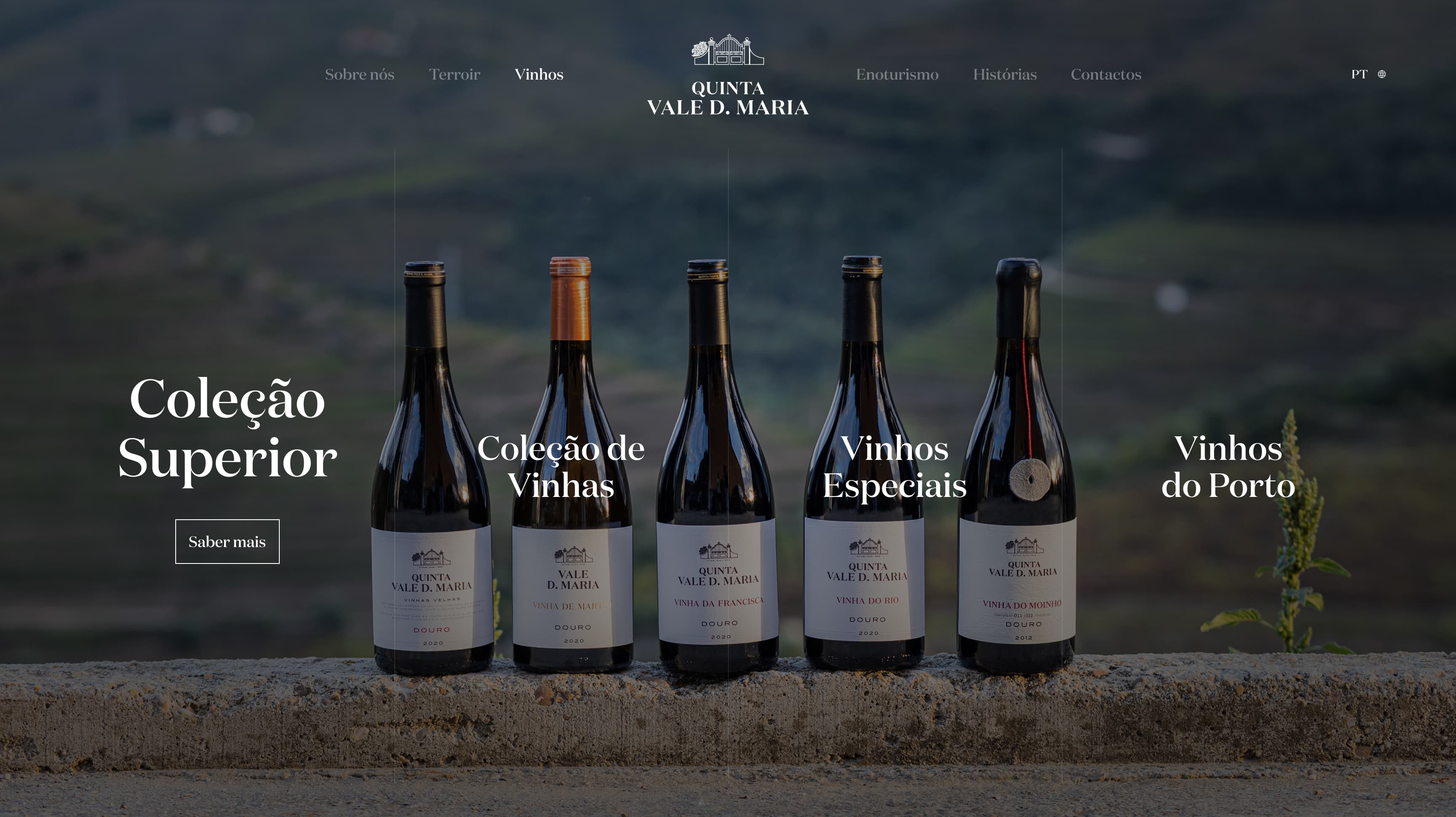 Quinta Vale D. Maria wine collections on the website homepage, with bottles lined up on a stone wall
